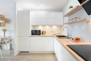 Blue and Beige Apartment with Mountain View and Parking by Noclegi Renters