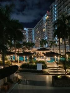 Spacious living room & big balcony - Pool View