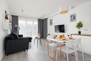Stylish Apartment with a Balcony and Parking Close to Nature by Noclegi Renters