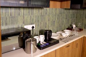 2 BHK Flat with Balcony Fleezio Stays Sec 42 Golf Course Rd