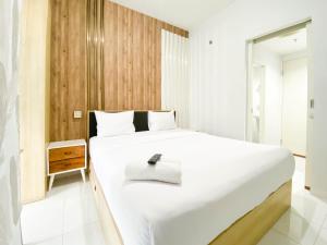 Homey 1BR without Living Room at Amartha View Apartment By Travelio