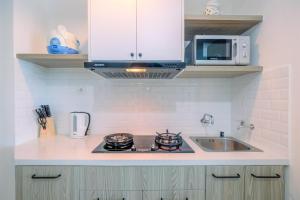 Fully Furnished with Comfy Design Studio Grand Kamala Lagoon Apartment By Travelio