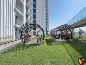 Vogue Vacation Homes, Arjan Skyz by Danube near Miracle Garden, One Bedroom Apartment with Balcony, Community and Dubai Outdoor Kart drome View, Access toAmenities