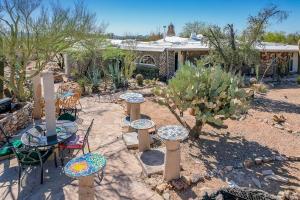 Artistic Earth House with Vibrant Glass Bottle Architecture Near Saguaro National Park in Tucson, Arizona