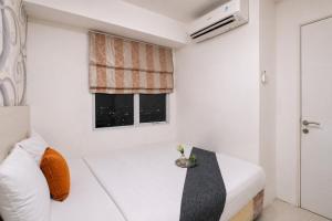 Exquisite 2BR Bassura City Apartment near Shopping Mall By Travelio