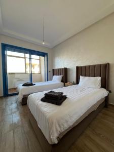 Appartement avec piscine en bord de mer