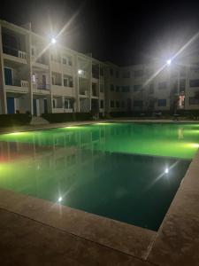Appartement avec piscine en bord de mer