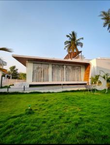 Boho sunset glass house nandi hills