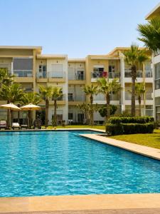 Appartement 2 chambres à CASABAY Sidi Rahal - 4 piscines, vue piscine et accès direct à la plage