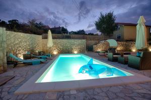 Modern villa with pool, quiet aria, privacy, nice garden - by TRAVELER Krk agency ID 2138