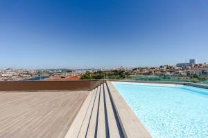 Premium Living with Pool, Balcony, Gym & Garage by HostWise