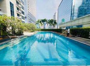 The Infinity Tower in BGC, 2BR City View with Parking by Alex Home