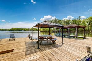 Lakefront home with two kitchens, a dock, firepit, & pontoon