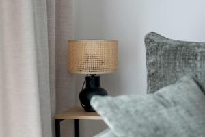 Functional Apartment with a Balcony and Parking Close to Green Spaces by Noclegi Renters