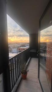 Modern apartment with balcony and sunset views