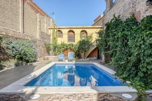Ca la Matilde, Apartamento con piscina en casa pairal