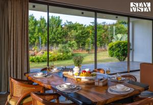 StayVista at Albert Palms - A Longitude Signature