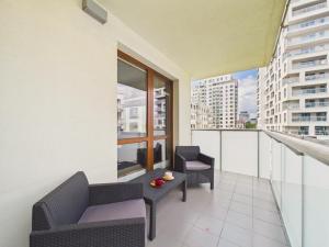 Wola CityView Apartment Balcony & Parking by Solarento