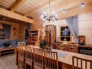 A large mountain-style house with a spa area
