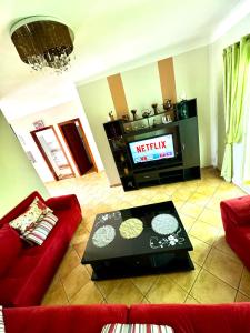 Charming Apartment with Balcony, Pool, Parking, and 2700m2 Garden