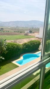 Charming Apartment with Balcony, Pool, Parking, and 2700m2 Garden