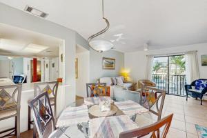 Charming condo with access to shared outdoor pool wifi & private balcony