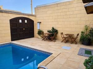 Two Connected Farmhouses in Gharb Gozo with 2 Private Pools Rooftops and BBQ Sleeps 16