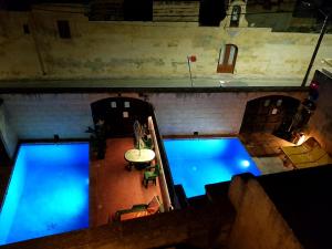 Two Connected Farmhouses in Gharb Gozo with 2 Private Pools Rooftops and BBQ Sleeps 16