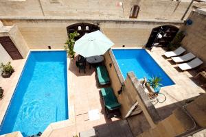Two Connected Farmhouses in Gharb Gozo with 2 Private Pools Rooftops and BBQ Sleeps 16