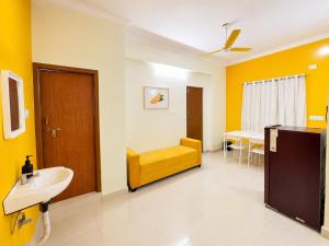 Yellow Delight 2BHK Themed flat near US Consulate