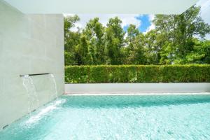 Brand new 4-bedroom villa with a high-ceiling living room, modern smart home, and private pool