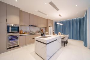 Brand new 4-bedroom villa with a high-ceiling living room, modern smart home, and private pool