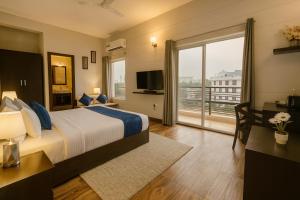 The Garnet Apartment With Balcony # Lift # Garden # Ac rooms # Private Parking # Near Prem Mandir # Located Inside- Omaxe Eternity Vrindavan #