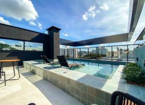 Loft com garagem, piscina e coworking no centro606