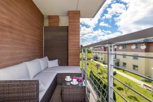Bright Apartment with a Balcony in Quiet Neighbourhood by Noclegi Renters