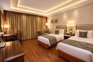 Hotel Grand Sky Nest suites Near International Airport