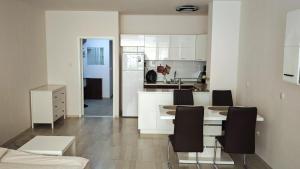 Apartment Garden - two large terraces with hanging chairs and sunset view