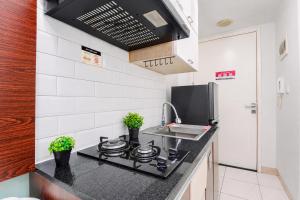 Fancy Studio at Springlake Summarecon Bekasi Apartment By Travelio