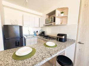 Apartamento completo-playa, piscina, tranquilidad