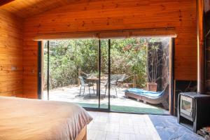 Ruca Lodge, habitación 2 personas cama king, desayuno, piscina, bosque costero