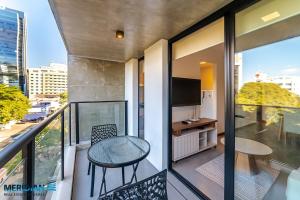 104 Steps from Shopping del Sol with private patio!