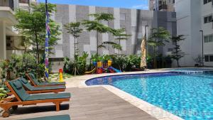Relaxing 2BR Signature Park Grande Apartment By Travelio