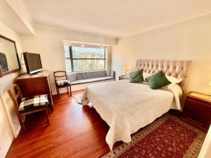 Spacious beachfront and steps from the mall