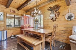 Real log cabin in the Pines with large game room!