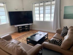 Large 4-bed Retreat Steps to the Beach!