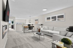 Airdrie 3BR Lake-View Home – King Suite, Fireplace, Central AC, Double Garage