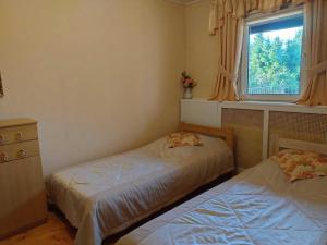 Half of a holiday home, huge garden, pond