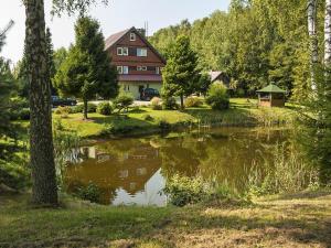 Half of a holiday home, huge garden, pond