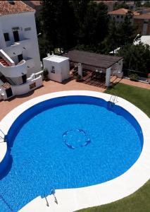 Pool-View Apartment with Terrace & Lift in Pueblo del Parque