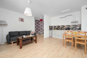 Family Apartment in Łódź with Balcony Close to the Park by Noclegi Renters